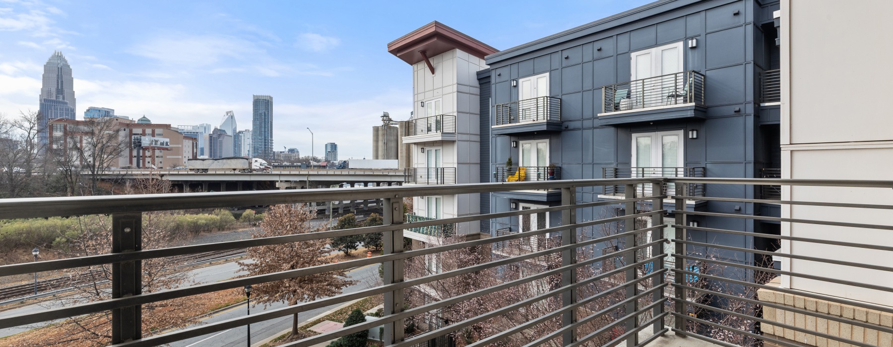 Iron Rail balcony overlooking city skyline
