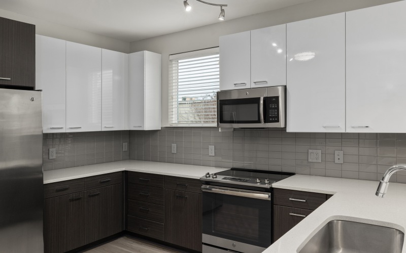 Kitchen with white cabinets and stainless appliances