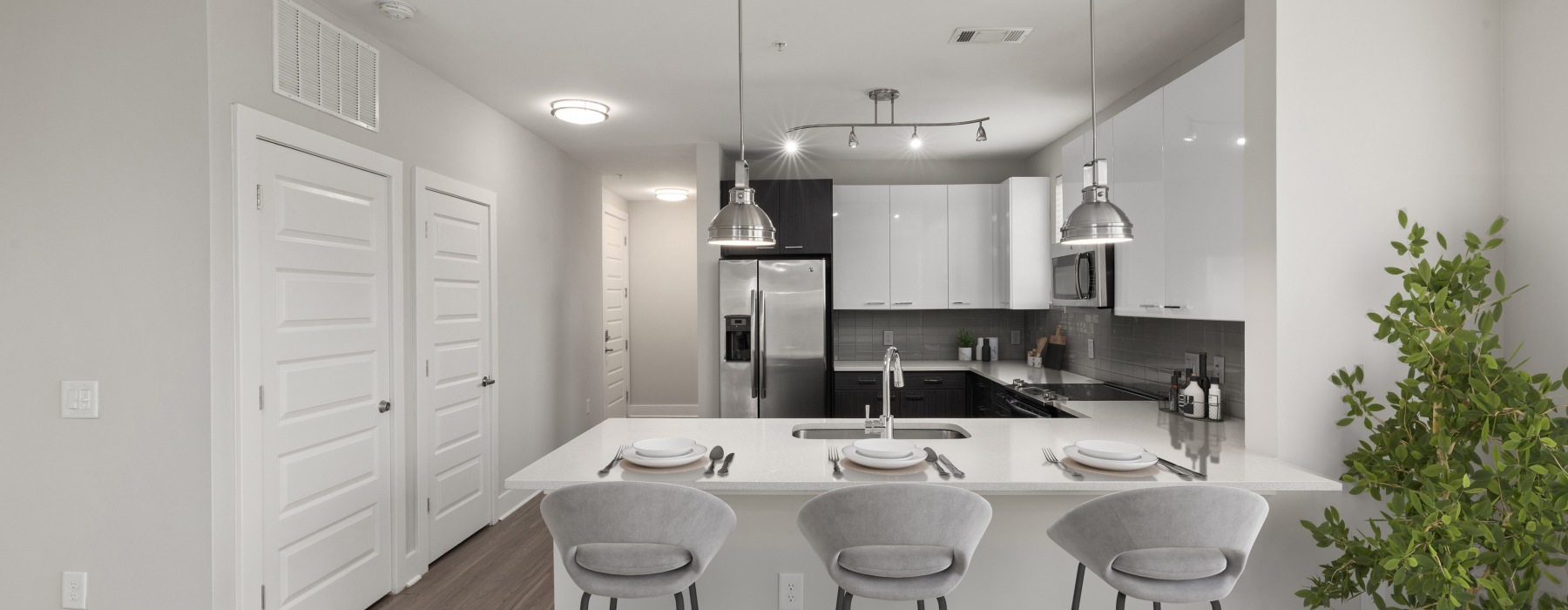 Kitchen with white cabinets and stainless appliances