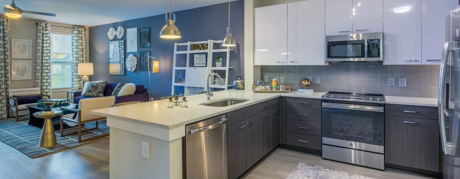 kitchen area on wooden floor with spacious counter-space and designer appliances